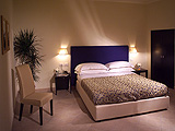 Superior double with city view, private facilities (bath and shower), and breakfast